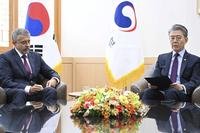 South Korea's Vice Foreign Minister Kim Hong Kyun, right, meets with Russian Ambassador to South Korea Georgy Zinoviev