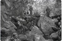 Marines of Company L, 3rd Battalion, 5th Marines, take a rest on rocky terrain near Dong Ha during Operation Hastings in Vietnam, July 1966.