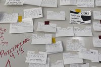 Index cards taped to a board on a wall at Fort Jackson.