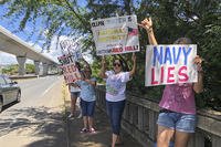 Protestors upset with the Department of Defense's response to the leak of jet fuel into the water supply