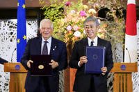 Japanese Foreign Minister Takeshi Iwaya, right, shakes hands with European Union foreign policy chief Josep Borrell