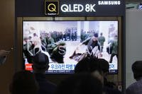 soldiers believed to be from North Korea standing in line to receive supplies from Russia