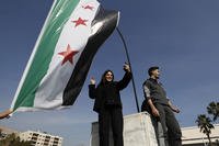 Syrians celebrate at Umayyad Square in Aleppo, Syria.