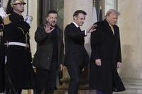 French President Emmanuel Macron, center, President-elect Donald Trump