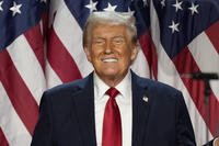 Republican presidential nominee former President Donald Trump smiles at an election night watch party