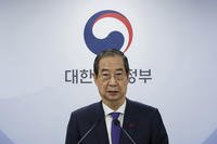 South Korea's acting President Han Duck-soo speaks at the government complex in Seoul, South Korea