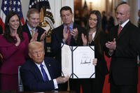 President Donald Trump signs the Laken Riley Act