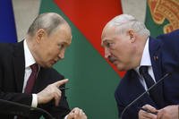 Russian President Vladimir Putin, left, and Belarusian President Alexander Lukashenko talk