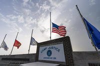 flags fly at half-staff at Camp Justice, Aug. 29, 2021, in Guantanamo Bay Naval Base