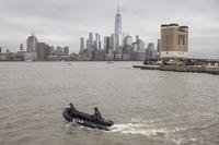 A New York Police Department scuba team looks for debris.