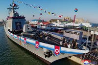 a ceremony to unveil a new naval destroyer at a western port in Nampo, North Korea