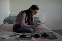 Woman reads letter from her husband.