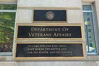 A sign outside the Department of Veterans Affairs headquarters features Abraham Lincoln's words