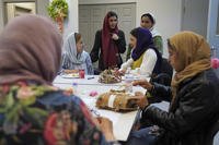 A group of female Afghan refugees gather for a class on self-care and a post-Ramadan celebration