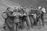 Recently released British prisoners of war meet up with a parachute recce party while marching towards Allied lines
