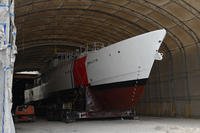 An uncompleted U.S. Coast Guard Cutter sits in a hangar bay at Bollinger Shipyard in Lockport, Louisiana