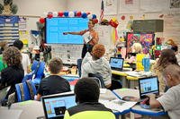 A teacher engages her 5th grade students in an interactive lesson at Kessler Elementary School