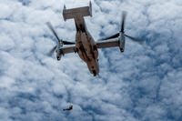 Air Force pararescueman conducts hoist operations from a MV- 22B Osprey