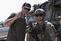 Secretary of Defense Pete Hegseth receives a coin