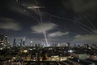The Israeli Iron Dome air defense system fires to intercept missiles during an Iranian attack over Tel Aviv, Israel