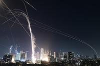 Israeli Iron Dome air defense system fires to intercept missiles over Tel Aviv