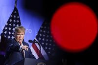 President Donald Trump addresses a news conference after a summit of heads of state and government at NATO headquarters