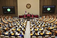 South Korean lawmakers pass a bill to launch special investigations into former President Yoon Suk Yeol's short-lived imposition of martial law