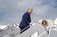 President Donald Trump boards Air Force One.