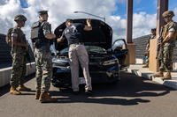 U.S. Marines conduct a vehicle inspection at Marine Corps Base Hawaii