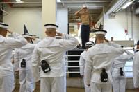 Marine 2nd Lieutenant Colin DuPont instructs incoming plebes on how to salute.