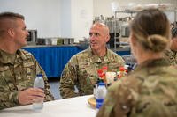 Chief Master Sergeant of the Air Force David Flosi speaks with airmen assigned to the 380th Air Expeditionary Wing during a visit at an undisclosed location within the U.S. Central Command area of responsibility.