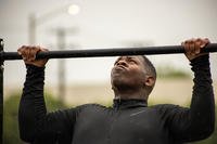 U.S. Marine Corps Sgt. Keyon A. Simmons-Harwell conducts a pull-up during a battalion workout challenge at Camp Elmore, Norfolk, Virginia.