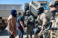 Federal immigration agents talk to Rebecca Torres