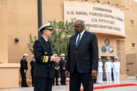 Then-Secretary of Defense Lloyd J. Austin III (right) speaks with Vice Adm. Brad Cooper, commander of U.S. Naval Forces Central Command (NAVCENT)