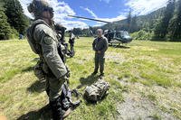 In this handout photo provided by the Snohomish County Sheriff's Office, deputies participate in the search for Travis Decker at an undisclosed location in Washington state, Friday, June 6, 2025.