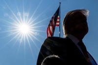 President Donald Trump speaks with reporters before departing on Marine One from the South Lawn of the White House