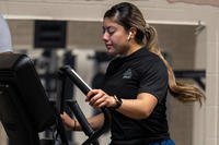 Staff Sgt. Alyana Vasquez exercises on an elliptical machine at Dover Air Force Base, Delaware, Jan. 11, 2023.
