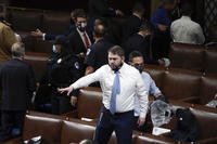 Rep. Ruben Gallego stands on a chair