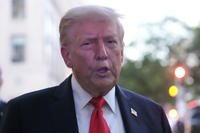 President Donald Trump speaks to reporters before he enters a restaurant near the White House