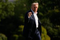 President Donald Trump gestures as he arrives at the White House