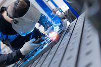A person welds.
