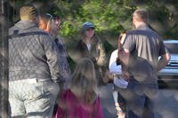 Family members gather outside of an explosive plant after a blast.