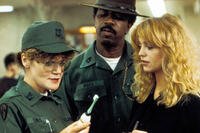 Private Benjamin (1980) – Capt. Doreen Lewis (Eileen Brennan) inspects gear with Sgt. L.C. Ross (Hal Williams) as Judy Benjamin (Goldie Hawn) looks on. Credit: Warner Bros. Pictures.