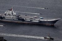 China's first aircraft carrier, the Liaoning, sails near Hong Kong.