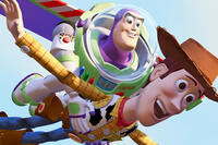 Buzz Lightyear carrying Woody as they fly through the air in Pixar’s Toy Story (1995).