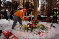 People gather for a vigil after an Immigration and Customs Enforcement officer shot and killed a motorist earlier in the day, Wednesday, Jan. 7, 2026, in Minneapolis. (AP Photo/Bruce Kluckhohn)
