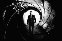 Daniel Craig as James Bond walking through the gun barrel in a stylized black-and-white image from Skyfall.