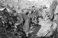 American &quot;doughboys&quot; of the 103rd Infantry pause from fighting trench warfare in France. Elements of the division began rotating into trenches along sectors of the &quot;Western Front&quot; in the spring of 1918. (Marine National Guard Archives photo)