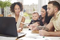A family looking at a laptop