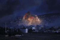 Smoke and flames from an airstrike by the U.S.-led coalition rise in Kobani, Syria, as seen from a hilltop on the outskirts of Suruc, at the Turkey-Syria border, on Monday. (AP photo)